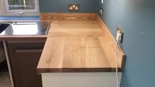 Solid oak worktop installation supplied by Worktops express [upl. by Anitsahs46]